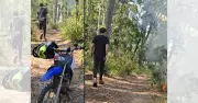 Police hunt motorbike rider after suspicious South Coast bushfire