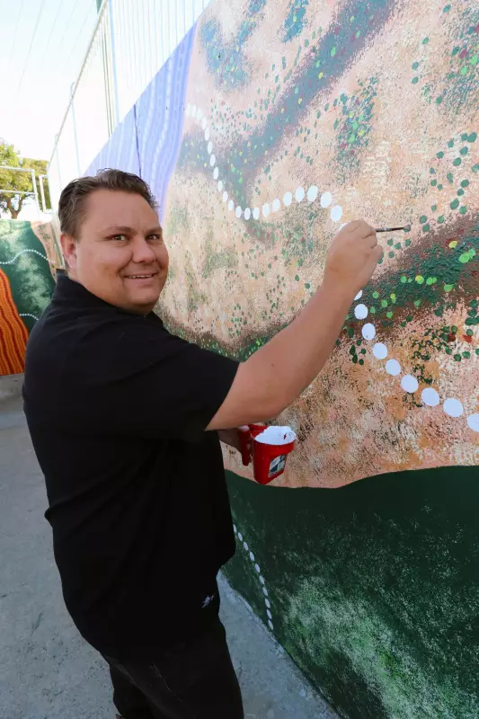Local Noongar Artist Rohin Kickett Transforms Maddington Underpass with River Mural