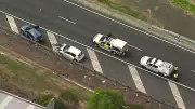 Man critically injured after being hit outside car on Logan Motorway