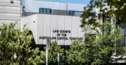 Man found bound and stabbed in Canberra unit after workers hear cries for help