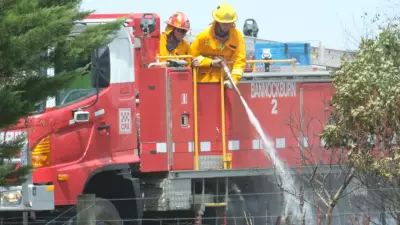 Shelford building fire spreads to grass, sparking emergency alert