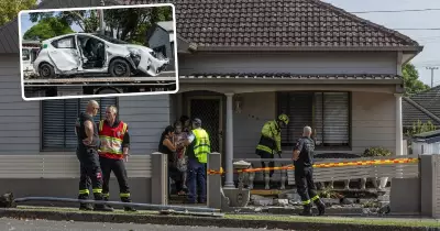 Elderly Woman Hospitalised After Car Collides with Bus and Crashes Through Fence in New Lambton
