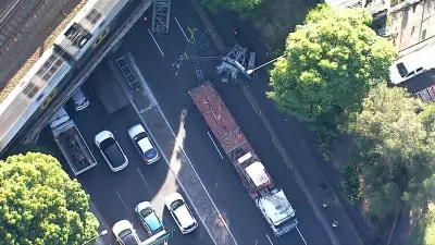 Crane Collapses on Busy Sydney Street, Causes Major Peak Hour Traffic Delays