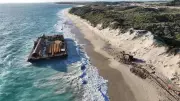 Massive Barge Washes Ashore at Alkimos Beach After Storm Breaks Moorings