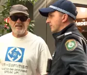 Man in swastika shirt questioned outside Bondi antisemitism inquiry