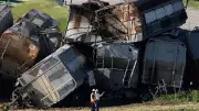 Train Derails in Iowa, Collides with Truck: One Dead, One Critical