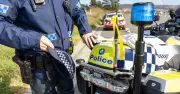 Motorcyclist charged after alleged scuffle with police in Gungahlin